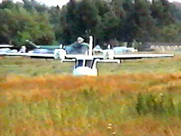 Accord-prototype airplane. Take-off run through high grass on rough field
